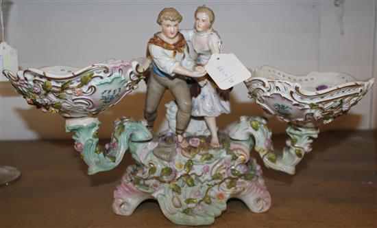 Meissen style centrepiece modelled a dancing couple flanked by two detachable pierced and encrusted dishes